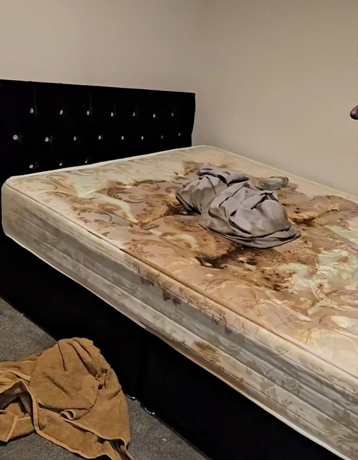 Harry Potter Airbnb with a stained mattress and messy sheets, showcasing poor guest conditions.