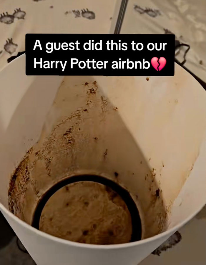 Dirty trash bin in Harry Potter Airbnb with message overlay about guest damage.