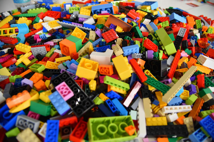 Colorful Lego bricks scattered, relevant to the controversy involving anti-LGBT claims and magnets.