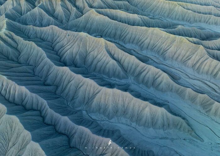 Intimate landscape photo by Michael Hindman showcasing textured ridges with natural patterns.