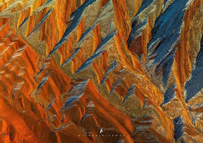 Intimate landscape photo with vibrant textures resembling natural geological formations by Michael Hindman.