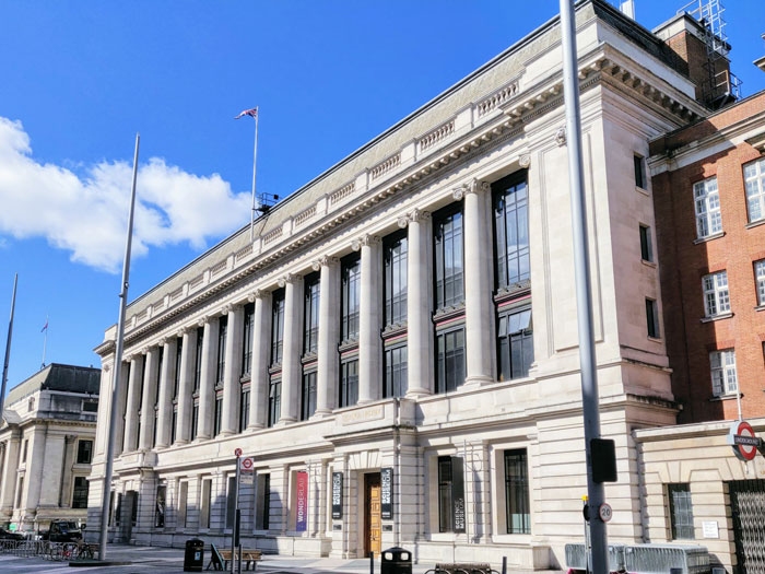 Science museum building under a clear blue sky, facing backlash over claims regarding magnets and Lego bricks.