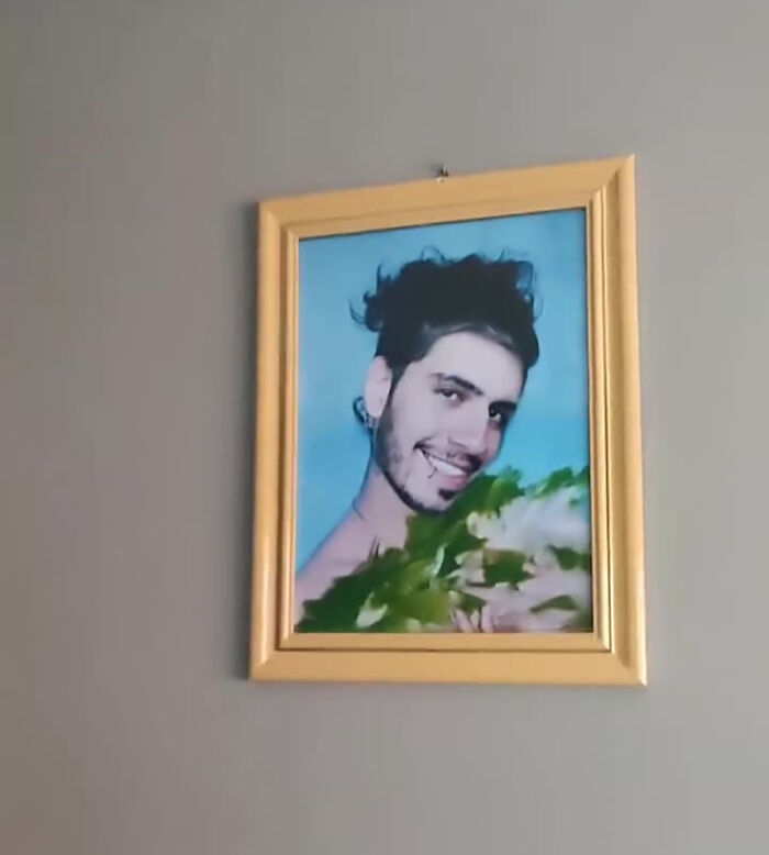 Framed photo of a man smiling, showcasing a humorous prank that amused many online.