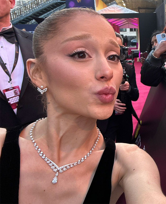 Ariana Grande on the red carpet with diamond jewelry, sparking concern about appearance, at a formal event.