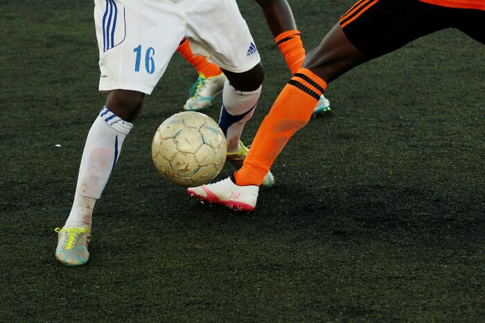 Players from Bayern and Celtic compete for the ball in a Champions League match.