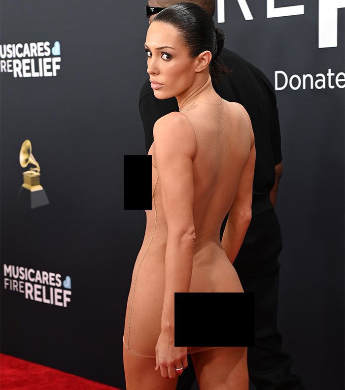 Bianca Censori in a daring outfit on the Grammys red carpet, garnering attention.