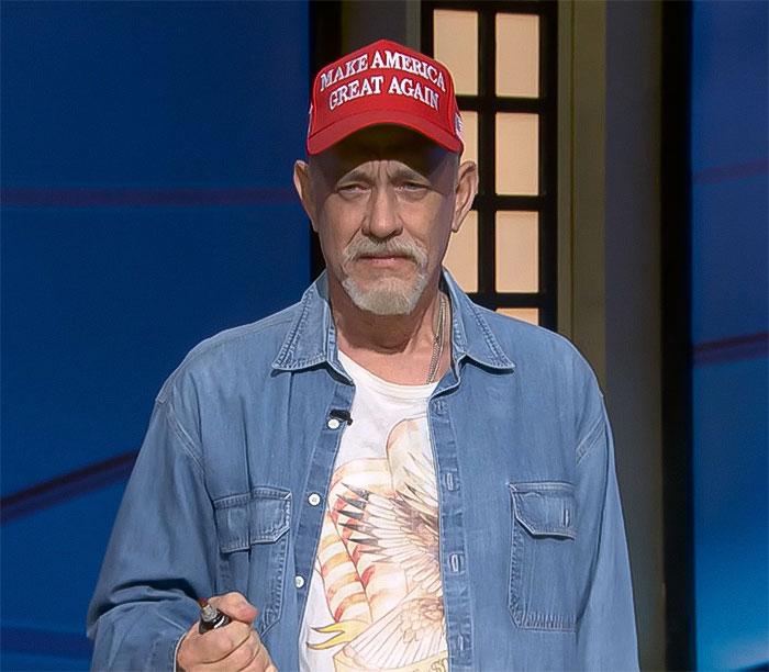 Man wearing a "Make America Great Again" hat and denim shirt on SNL stage, portraying a MAGA supporter.