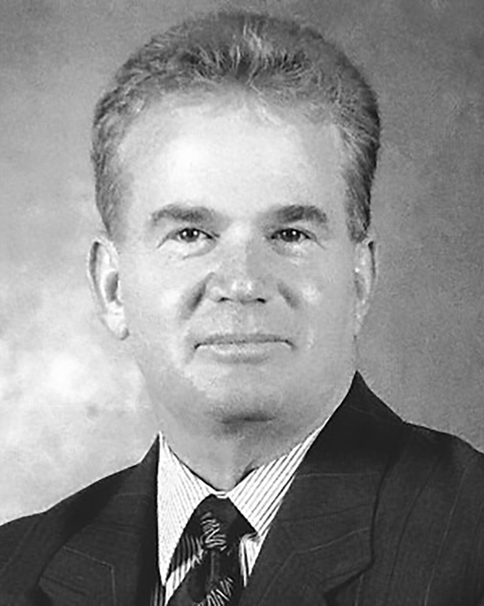 Black and white portrait of a man in a suit, related to evicted veteran's family statement.