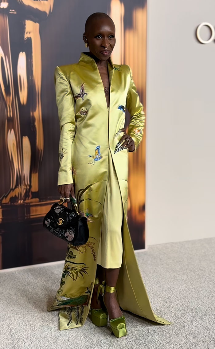 Oscar nominee in a yellow embroidered suit with matching shoes, attending the 2025 nominees dinner.