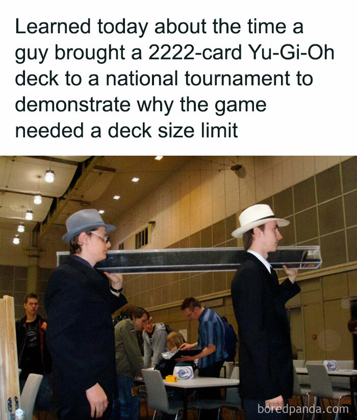 People spotting a "Final Boss" in real life: two men carrying a massive Yu-Gi-Oh card deck at a tournament.