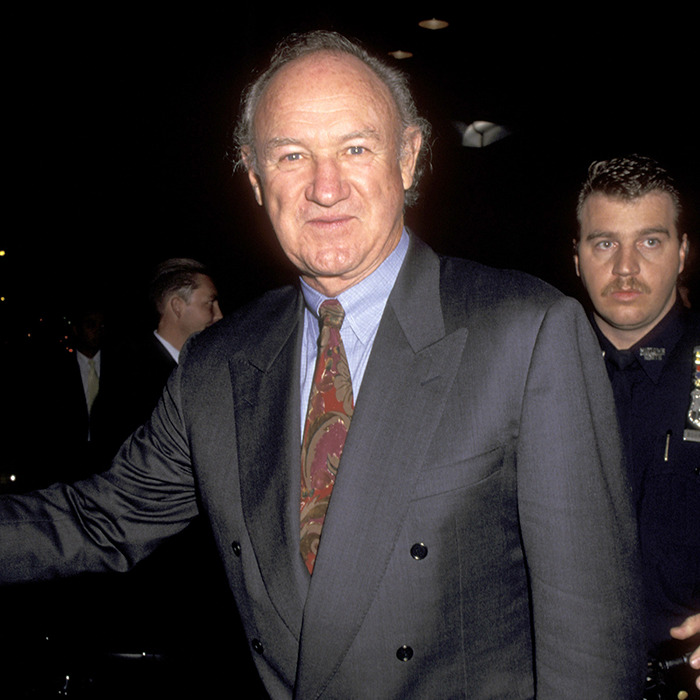 Man in a suit at an event with security behind, related to carbon monoxide poisoning concerns.