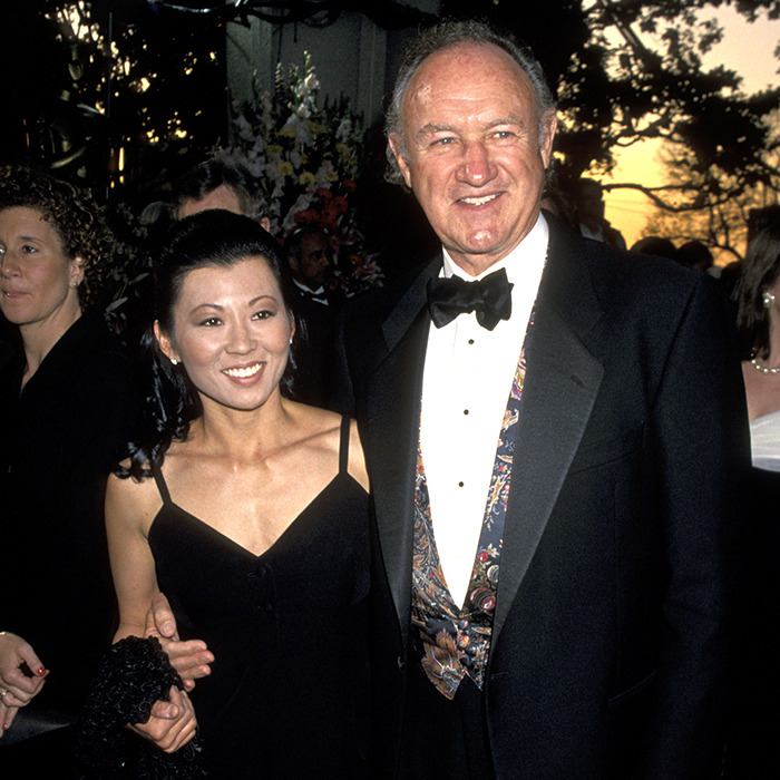 Elegant couple in formal attire at an event, highlighting concerns about carbon monoxide poisoning.