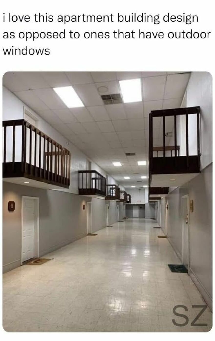 Strange apartment building interior with indoor balconies and fluorescent lights, highlighting unusual architecture design.