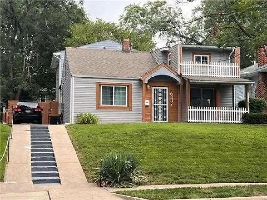 House with mismatched facade and awkward driveway, showcasing architecture shaming.