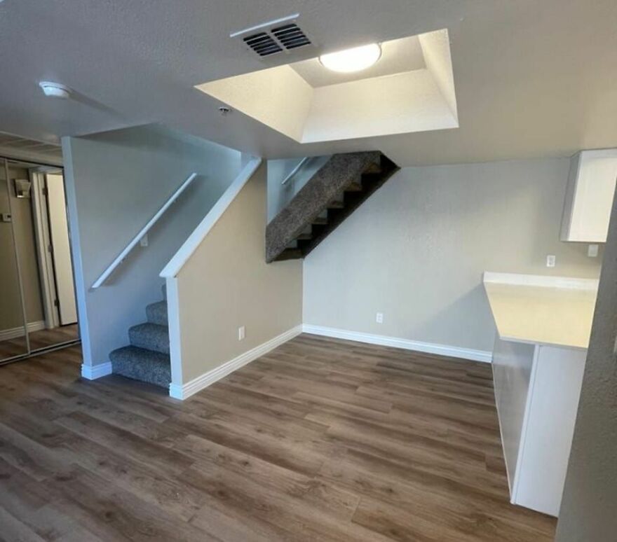 Unusual interior with awkwardly placed stairs, showcasing poor architecture design.