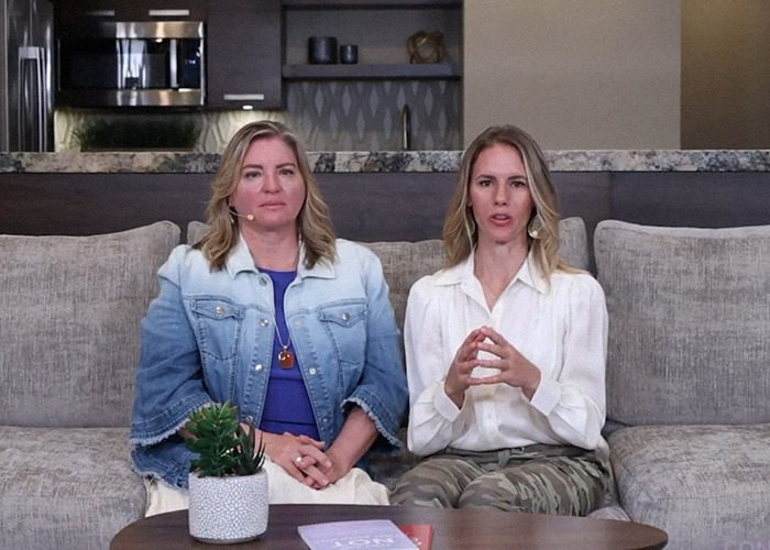 Two women sitting on a couch, discussing themes from the Ruby Franke docuseries.