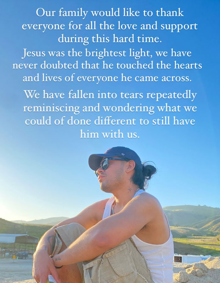 Man in a cap and sunglasses, sitting outdoors with hills in the background, accompanied by a heartfelt tribute to Jesus Guerrero.