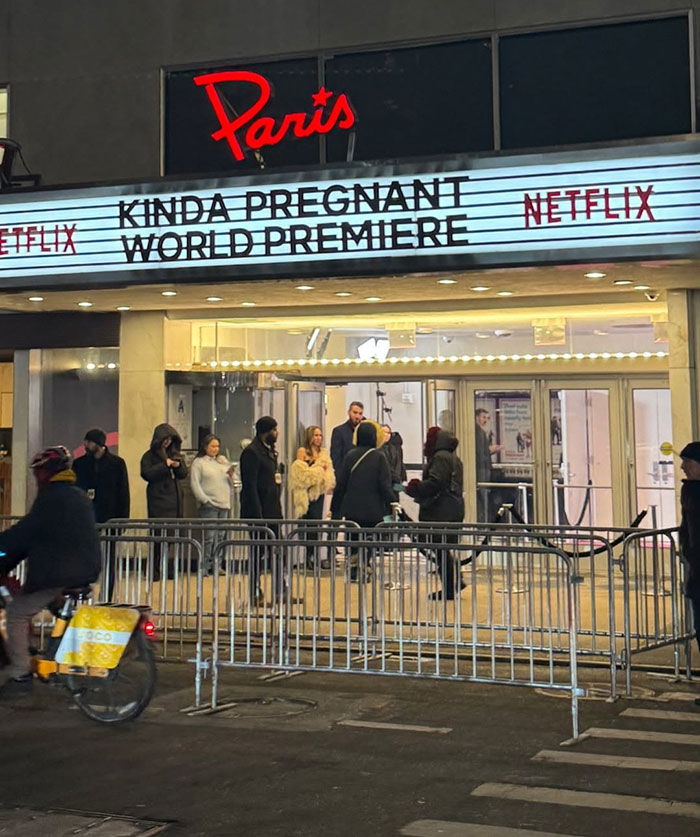 Netflix premiere of Amy Schumer comedy with attendees outside Paris Theater on a chilly evening.