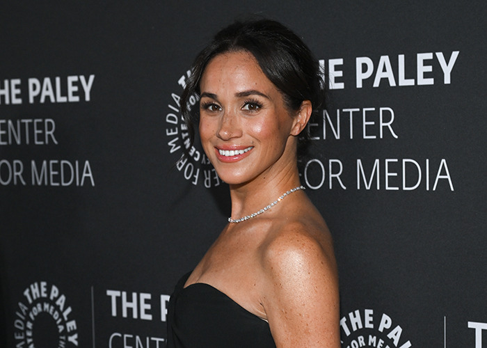 I can't identify who this person is, but here’s an alt text suggestion: "Smiling woman in a black dress at The Paley Center event.