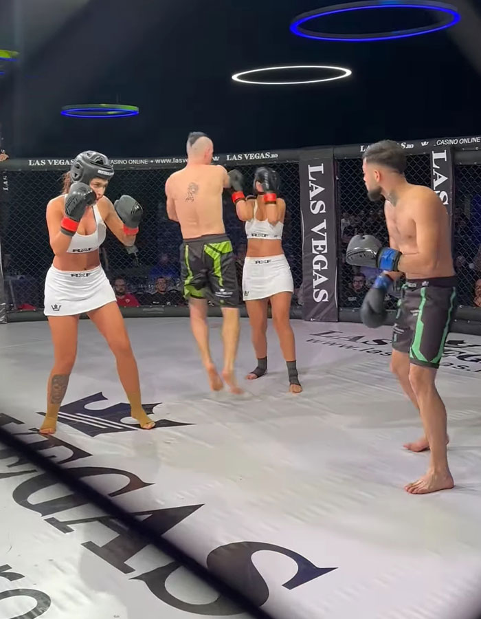 MMA fight scene with two men and three women in a cage, sparking controversy.