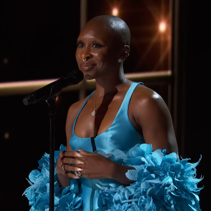 Cynthia Erivo in a blue dress at a microphone, related to musical casting.