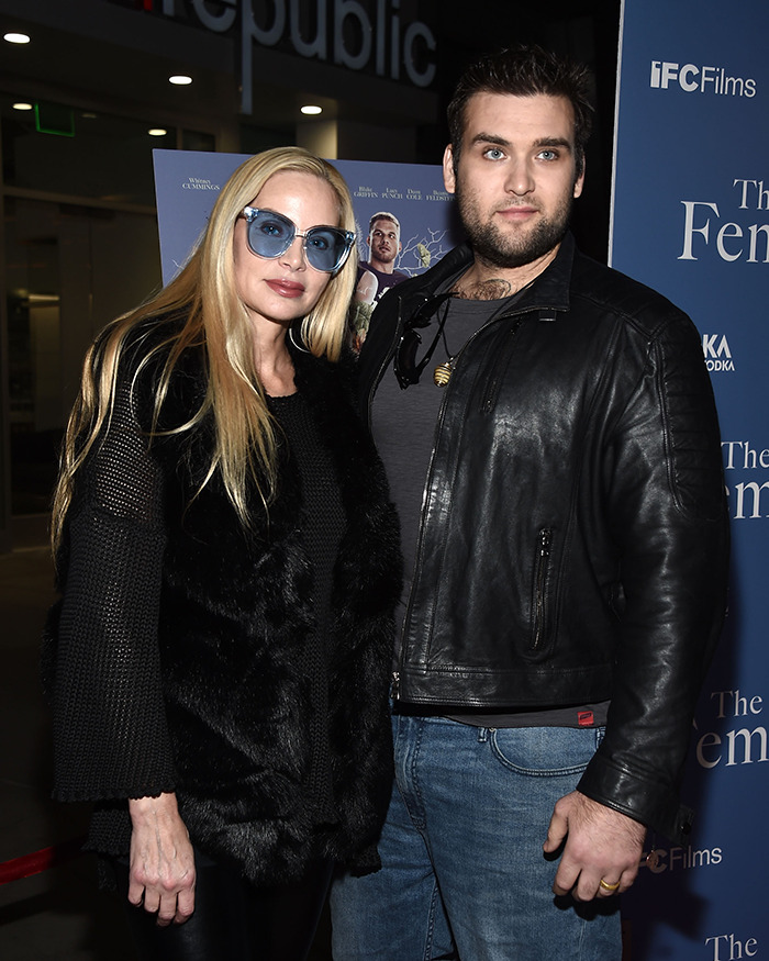 Man and woman posing at a film event, related to Nicolas Cage lawsuit news.