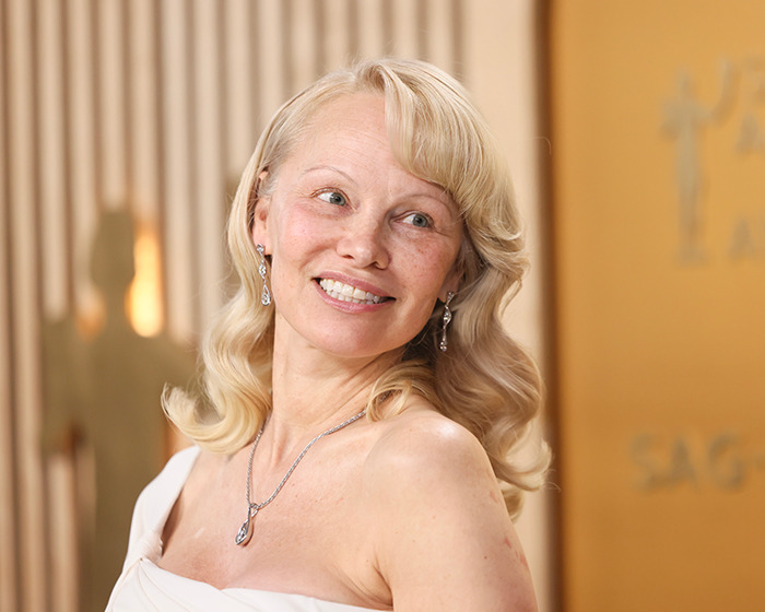 Makeup-free woman with blonde hair and elegant jewelry at the 2025 SAG Awards.