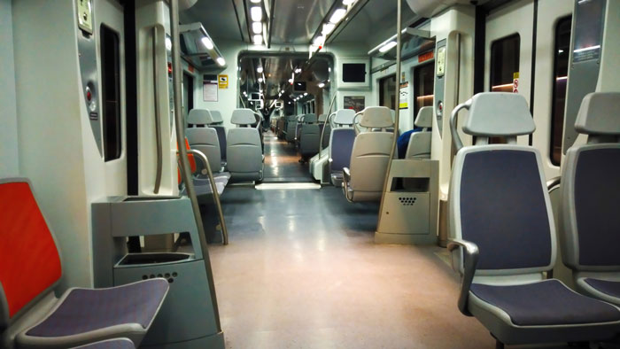 Empty train seats in a well-lit carriage, highlighting a scene related to prepaid seat discussions.