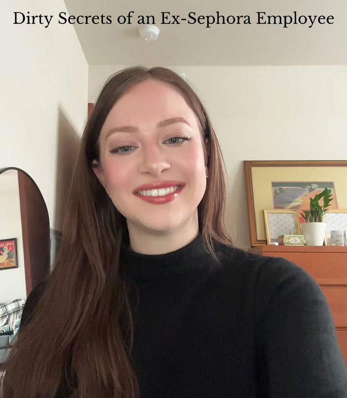 A woman smiling in a room, revealing Sephora's hidden product secrets.