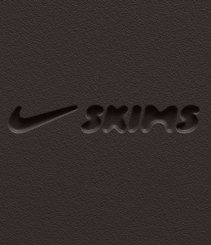 Logo of Nike and Skims collaboration on a textured dark background.