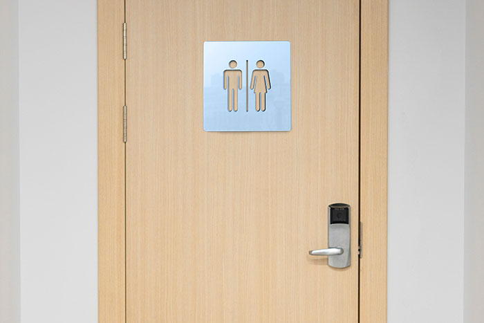 Restroom door with a gender sign, possibly indicating signs of a bad restaurant experience.