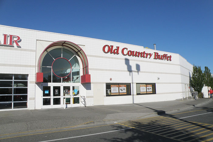 Old Country Buffet exterior, clear day, focus on restaurant entrance sign.