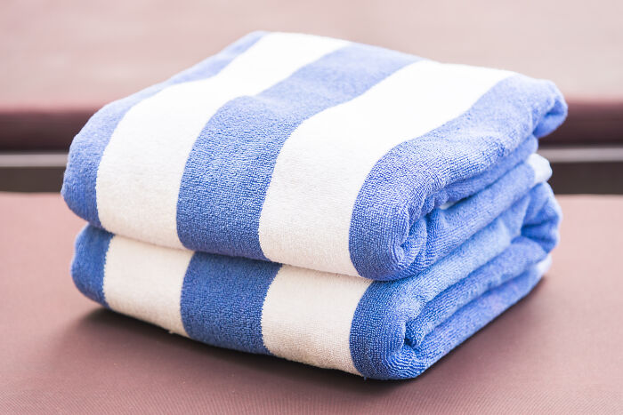 Blue and white striped towels, a travel must-have for enhancing the way you pack.