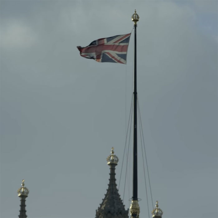 UK flag atop a building, cloudy sky, related to Polish woman Madeleine McCann news.