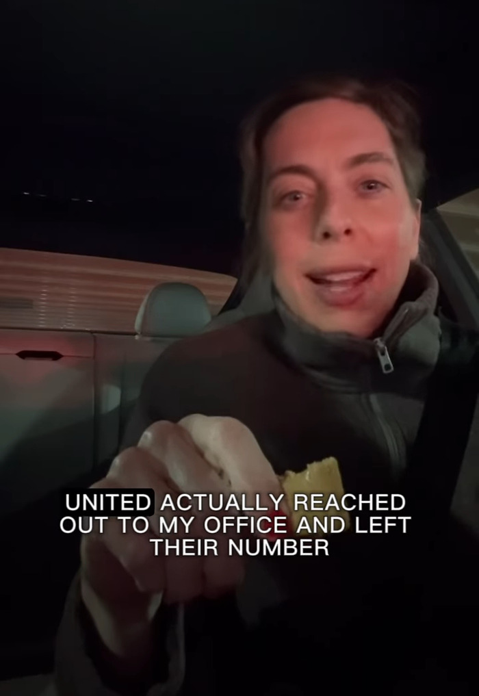 A person in a car discusses UnitedHealthcare and a legal issue, holding a snack.