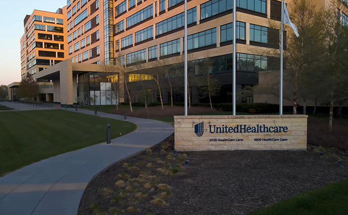 UnitedHealthcare office building exterior with signage in the foreground.