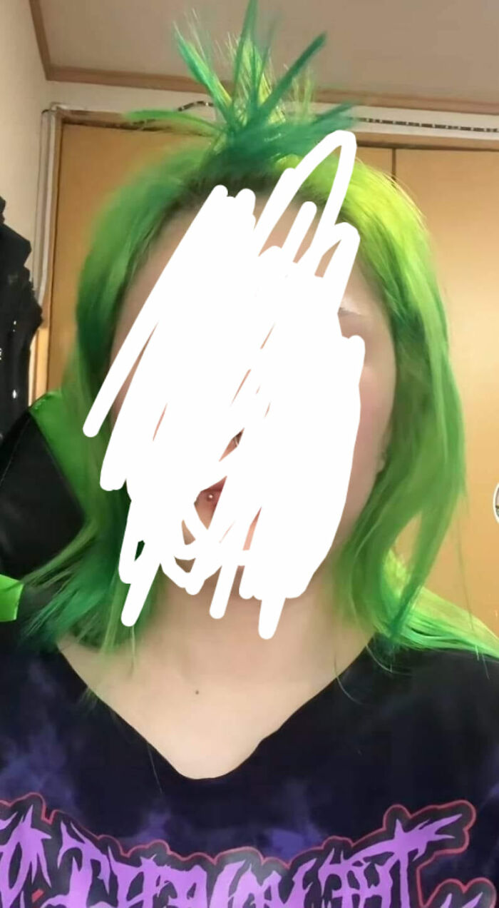 Unusual green hair fail with uneven spikes and bold color choice.