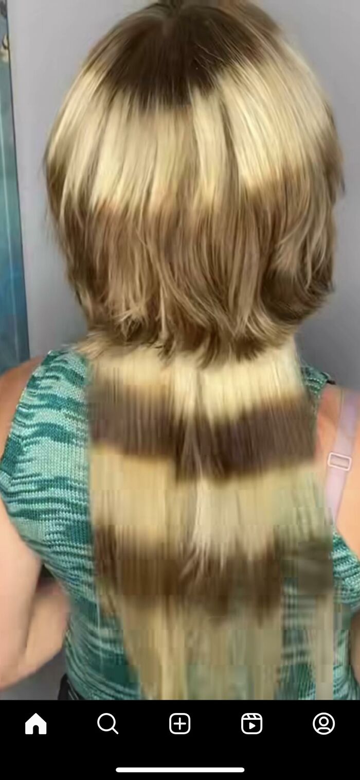 A person with a staggered blonde haircut showing uneven layers and coloring, exemplifying a hair fail.