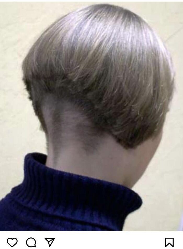 Unusual haircut fail with uneven layers, showing hair shaved underneath.