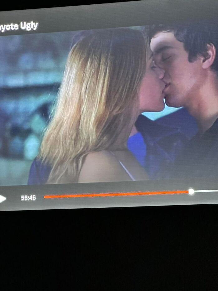 Screenshot from a scene in "Coyote Ugly" shows a couple kissing with hair featured prominently in the frame.