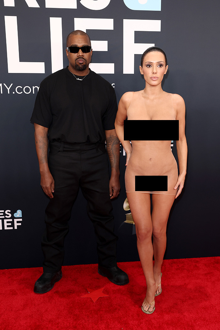 AI meme of Kanye West on red carpet with a woman in revealing outfit, highlighting fashion controversy.