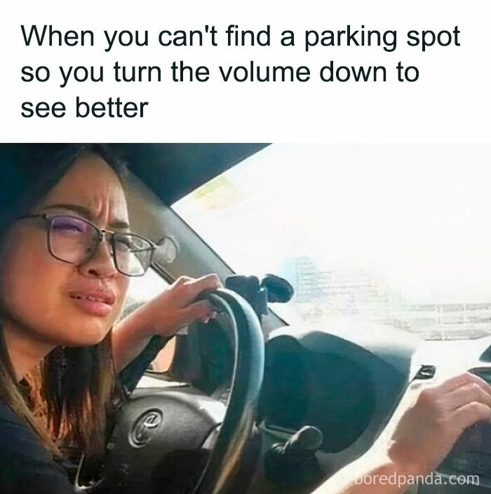 Woman in a car adjusting volume, squinting to see better; a humorous internet meme moment.