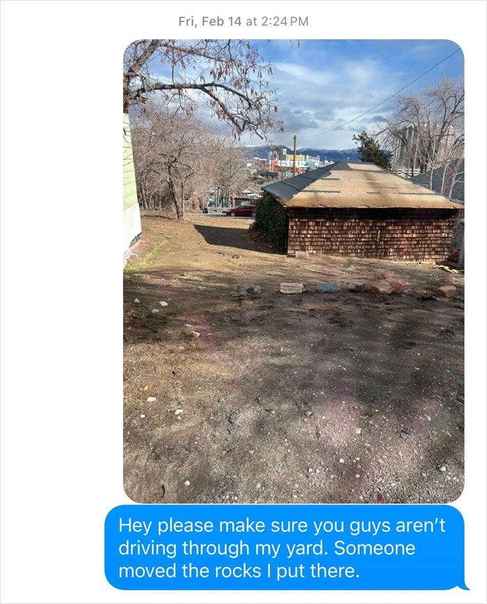 Open yard with rocks, message warns about driving through it; prevention strategy implied.