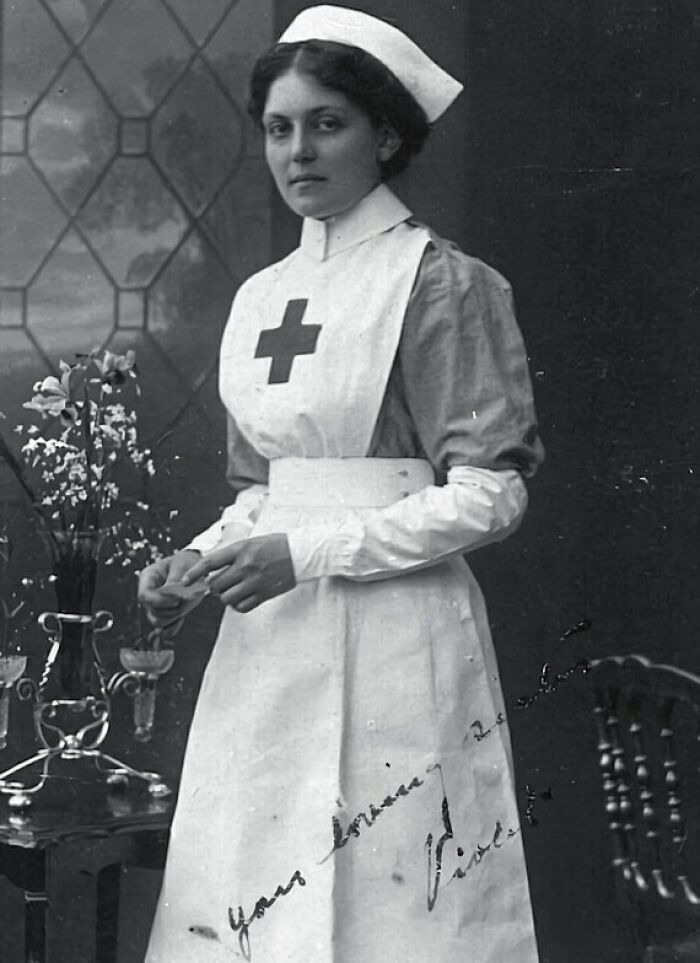 Historic nurse portrait with a Red Cross emblem, black and white imagery, representing captivating Wikipedia content.