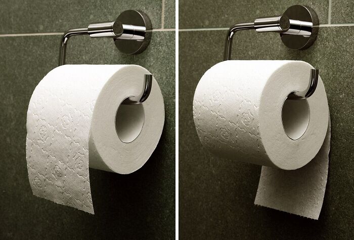 Two toilet paper rolls on holders with different orientations.