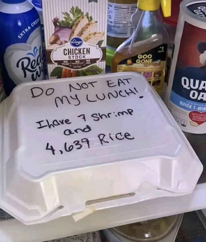 Labeled lunch container warning others not to eat it, with humorous note about shrimp and rice count.