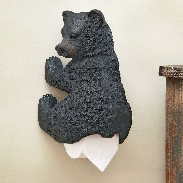 Bear-shaped toilet paper holder, a whimsical touch for toilet humour decor.