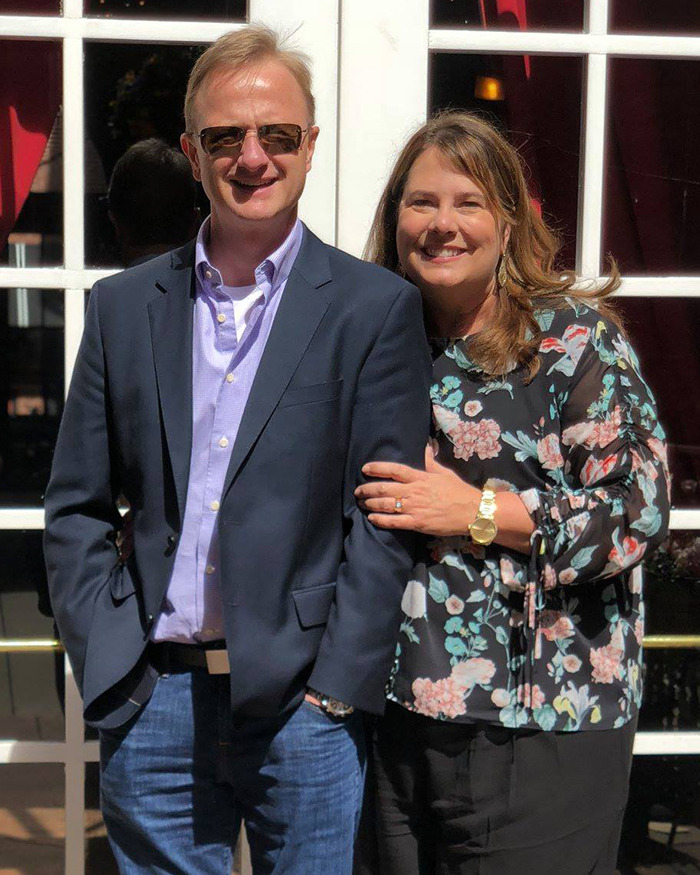 Man in sunglasses and woman smiling together outdoors, related to casino lawsuit.