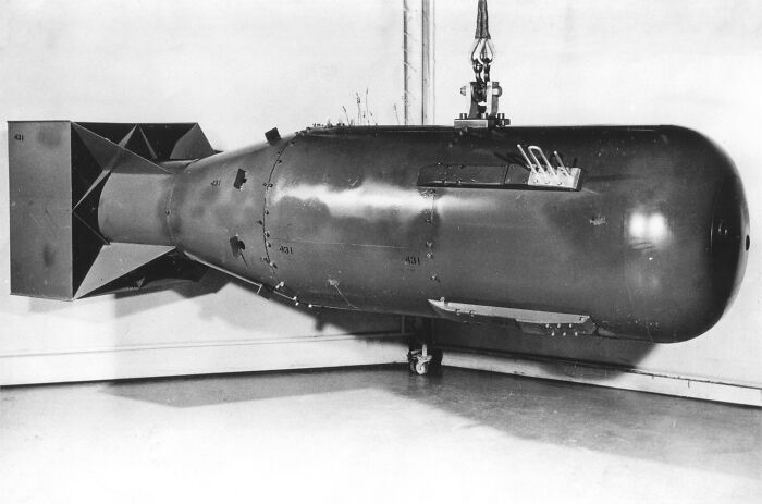 Historic atomic bomb displayed in a museum setting, showcasing a notable subject from cool Wikipedia articles.