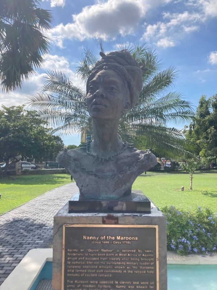 Bust of Nanny of the Maroons in a park, highlighting a cool Wikipedia article to explore.